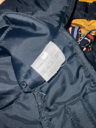 Mochila portabebés Cam azul y negro ergonómica