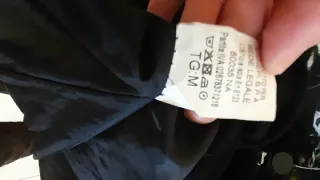 Cappotto nero con pelliccia sintetica