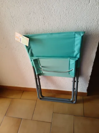 Silla de playa plegable color turquesa tengo 4