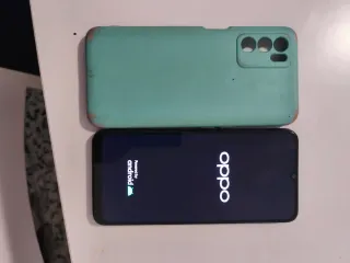 OPPO A54s con funda y cable de carga