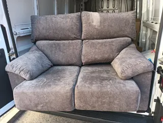 Sofá 2 plazas gris tela como nuevo,apenas se uso.