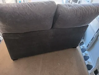 Sofá 2 plazas gris tela como nuevo,apenas se uso.