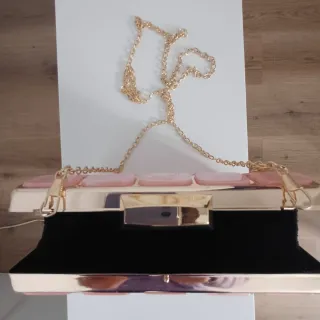 Bolso de fiesta rosa y dorado