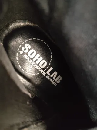 Botas altas de piel negras con tacón