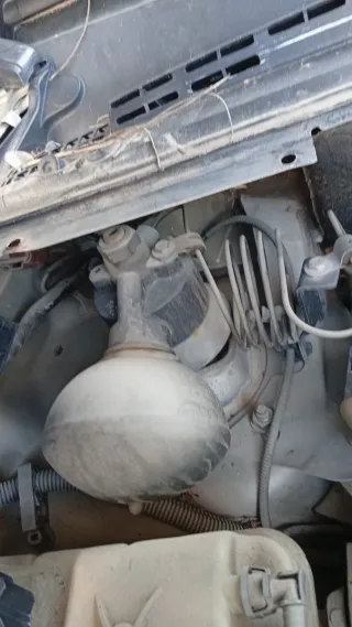 Amortiguador derecho y brazo suspensión izq