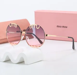 Gafas de sol Miu Miu doradas y rosas