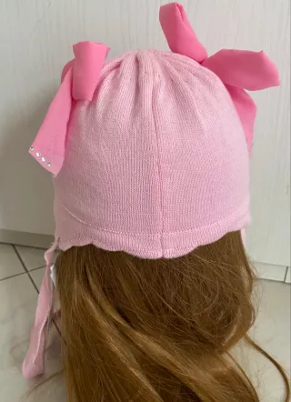 Cappellino rosa  Barbaras 3/12 mesi con fiocchi