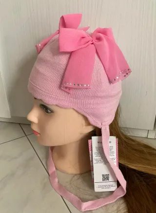 Cappellino rosa  Barbaras 3/12 mesi con fiocchi