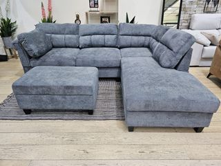 Sofá cama rinconera gris con puff