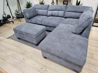 Sofá cama rinconera gris con puff