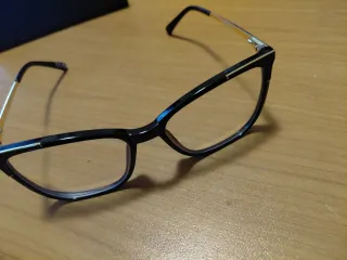 Occhiali da vista neri e oro con custodia