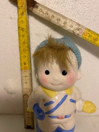 Salvadanaio bimbo con cappello blu