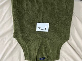 Chaqueta verde de punto sin mangas