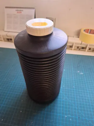 Botella fuelle líquido fotográfico