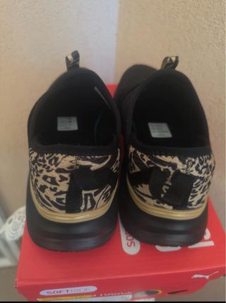 Scarpe Puma nere e oro
