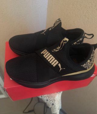 Scarpe Puma nere e oro