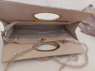 Bolso de mano floral con asa dorada