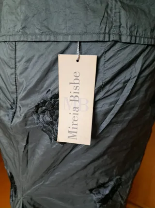 Traje de falda y chaqueta azul petróleo