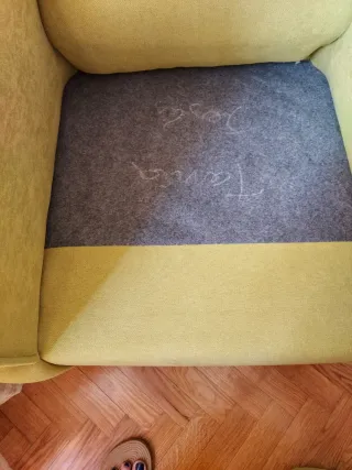 Sillón orejero verde tela