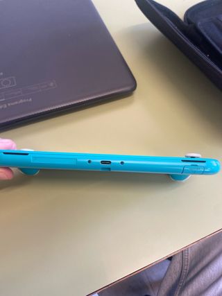 Nintendo Switch Lite Turchese con custodia