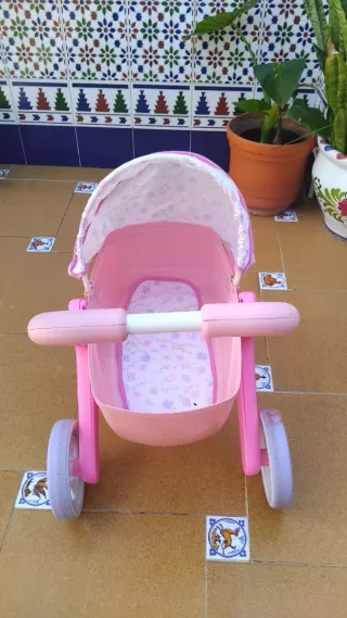Cochecito de muñecas rosa