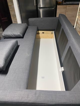 Sofá cama gris de tela