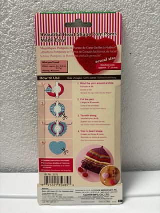 Aparato para hacer pompones en forma de corazón