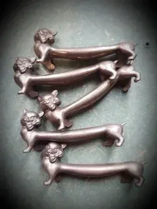 Antiguos reposa cubiertos gato