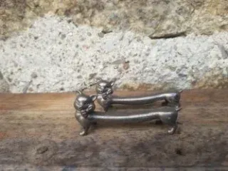 Antiguos reposa cubiertos gato