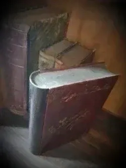 Antigua caja de madera con forma de libro