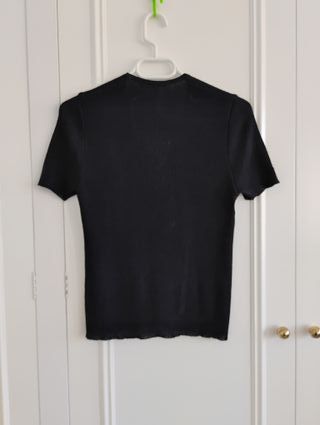 Jersey negro cuello en V m/c