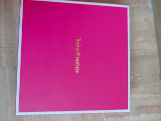 Collar metálico con colgante de lazo nuevo