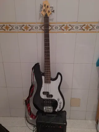 Bajo eléctrico + amplificador, funda y cable