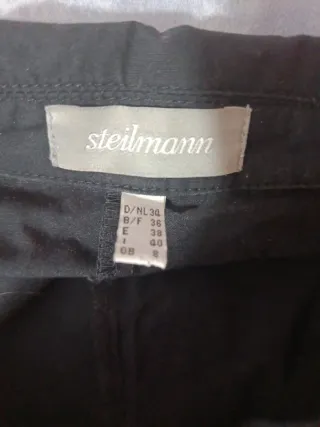 Traje negro chaqueta y pantalón