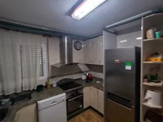 Muebles de cocina beige y verde