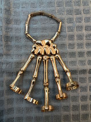 Pulsera esqueleto mano oro
