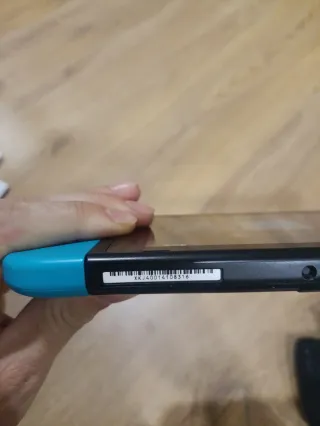 Nintendo Switch con juegos Super Mario y Smash Bro