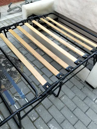 Sofá cama beige y gris de tela