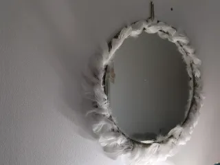 Espejo decorativo con plumas