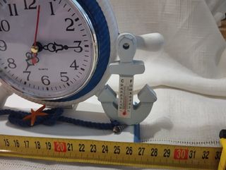 Reloj timón y faro náutico