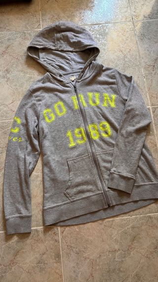 Giubbotto sportivo grigio con lettere gialle Taglia