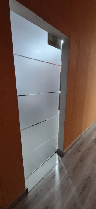 Puerta corredera de cristal