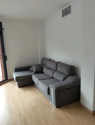 Sofá chaiselongue gris tela