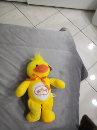 Peluche papera gialla con fiocco