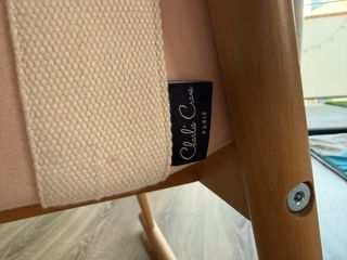 Moisés bebé rosa con patas de madera