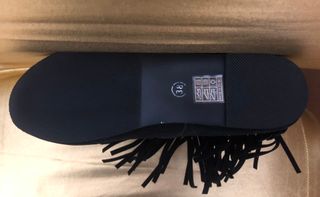 Botas planas ante negro con flecos