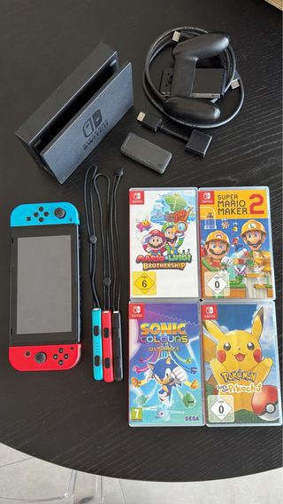 Nintendo Switch + 4 juegos + accesorios