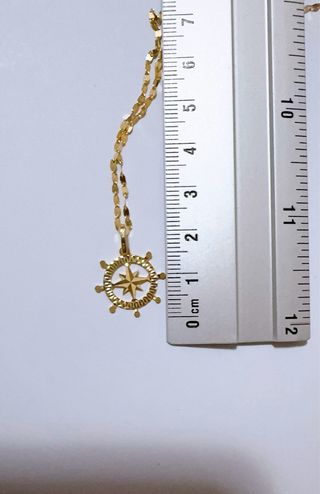 Collana con timone e rosa dei venti oro 18kt 750