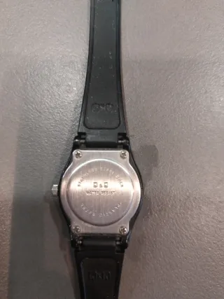 Reloj Swatch Negro y Plateado