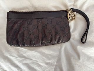 Pochette Gucci in pelle marrone